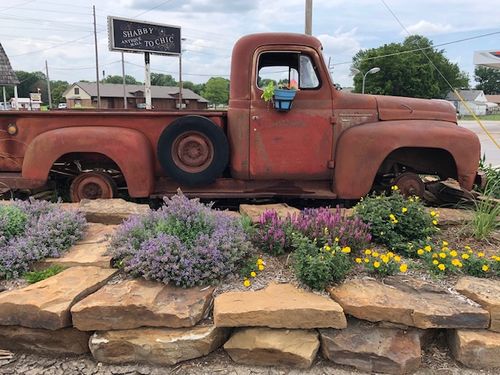image features a vintage 1952 International Harvester L-110 pickup truck, which is part of the International L-Series